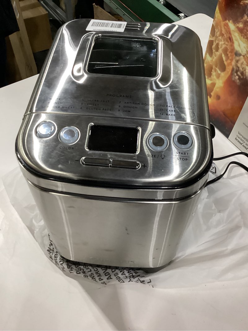 Condition photo showing As Is for *Not Tested*   Cuisinart Bread Maker Machine, Stainless Steel Automatic Bread Machine with 12 Menu Options, 3 Loaf Sizes up to 2 Lb., 3 Crust Colors, Removable Nonstick Baking Pan & Kneading Paddle, CBK-110NAS Compact Machine