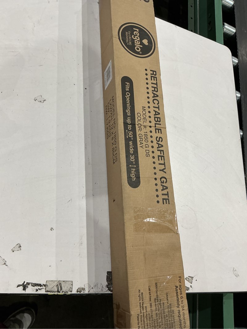 Condition photo showing New/Like New for regalo extra wide retractable baby gate, award winning brand, expands up to 50" wide, easy install, includes installation template, locking indicator