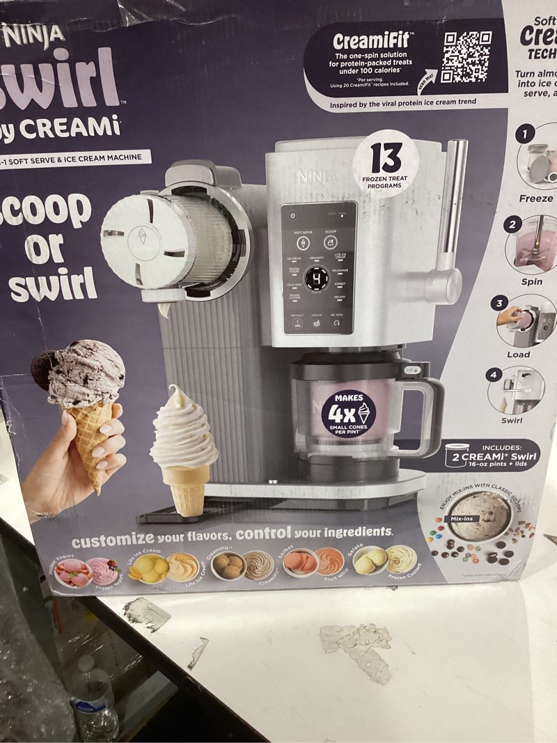Condition photo showing New/Like New for Ninja CREAMi Scoop & Swirl Ice Cream Maker, Soft Serve Desserts, Sorbet, Milkshakes, Frozen Yogurt and More, 13-in-1 Programs, Includes Handle and Two 16 oz 2-in-1 Pints, NC701 CREAMi Swirl