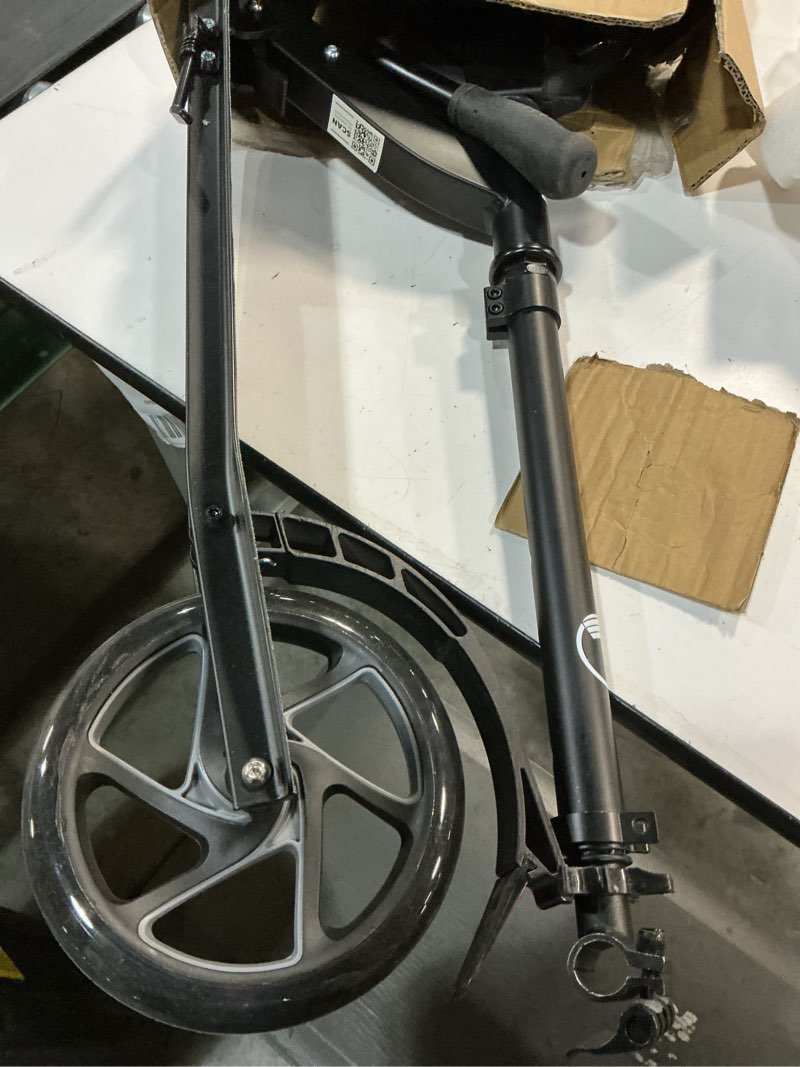Condition photo showing As Is for lascoota kick scooter for kids ages 6+, teens & adults, large 8" sturdy urethane wheels. adjustable handlebar, lightweight, foldable, 220lbs max load black scooter