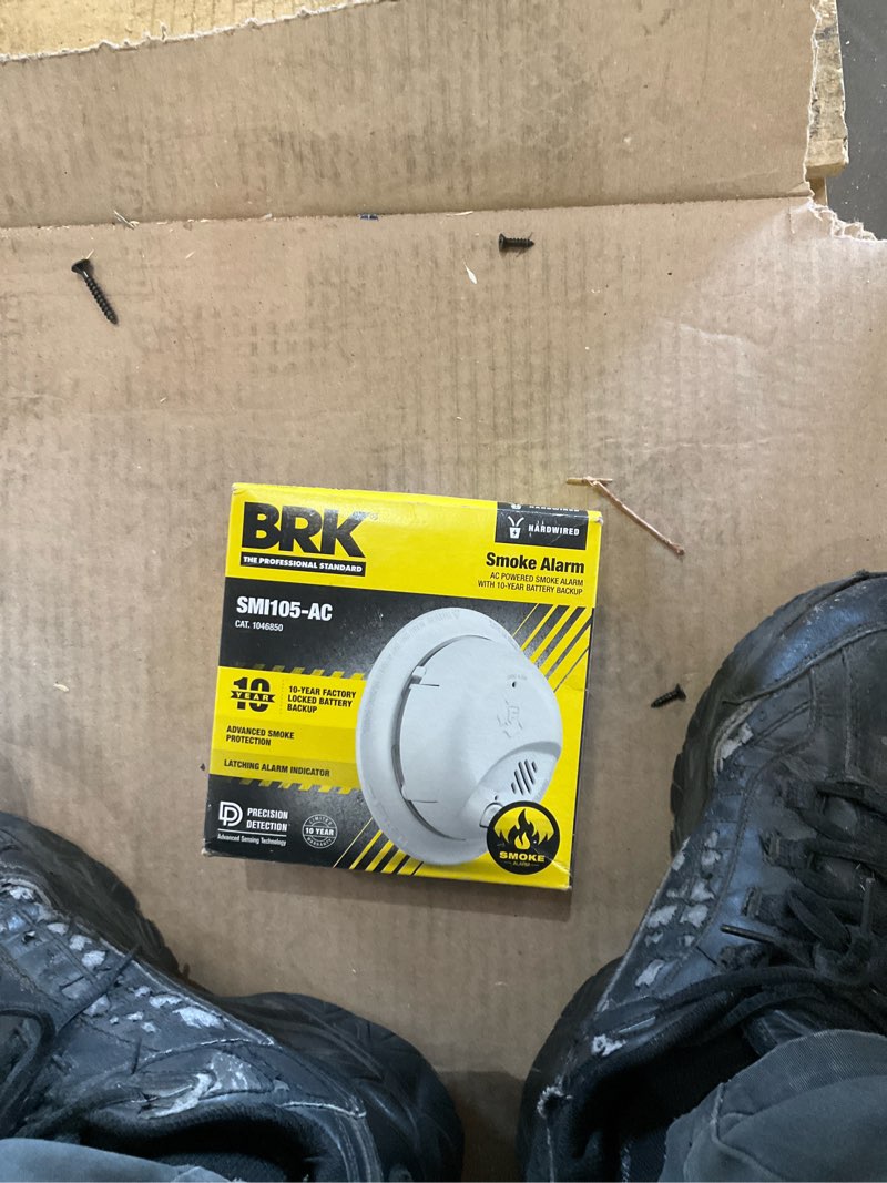 Condition photo showing As Is for brk 1046850 hardwired smoke alarm  10-year battery backup - quantity 1