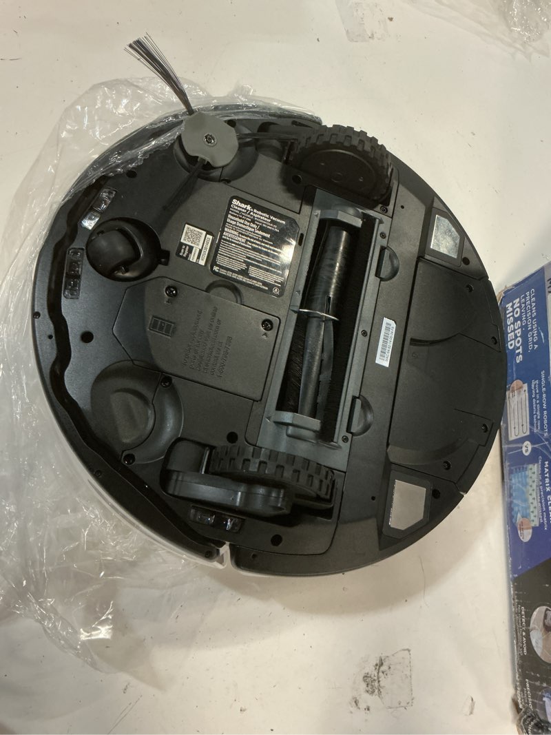 Condition photo showing As Is for shark iq robot vacuum with bagless self-empty 60 day capacity base, multi-surface cleaning, powerful suction, pet hair pickup, for carpets & hardfloors, home mapping, white, rv2302ae