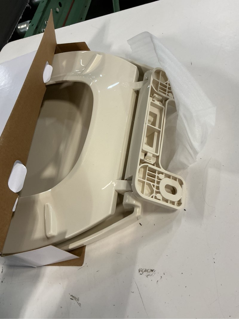 Condition photo showing As Is for gerber elongated toilet seat with cover, soft close, no slam, quick & easy install, heavy-duty plastic, adjustable fit for standard elongated toilets, durable & fade-resistant, bone g009921325