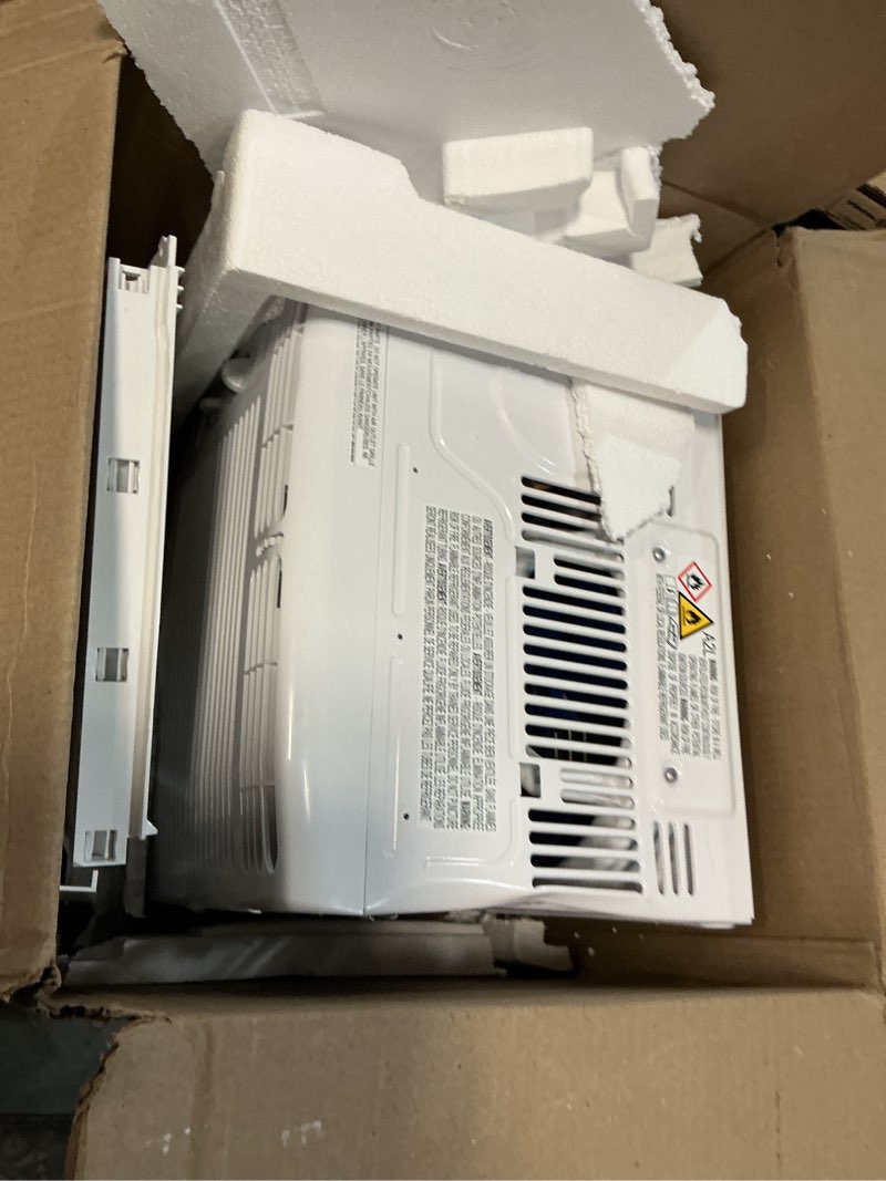 Condition photo showing As Is for frigidaire 5,000 btu window-mounted air conditioner, cools up to 150 sq. ft., quiet operation, effortless temperature control, 2 fan speeds, auto restart, white 5,000 btu mechanical controls