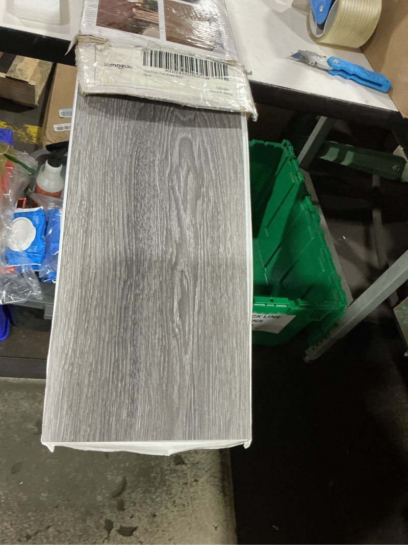 Condition photo showing Good Condition for inmozata peel and stick floor tile, 36packs 54 sq. ft vinyl flooring plank 36"x 6" peel and stick vinyl flooring tile waterproof wood grain for bedroom, living room, kitchen, rv(deep gray) 36 x 6 inches deep gray 36
