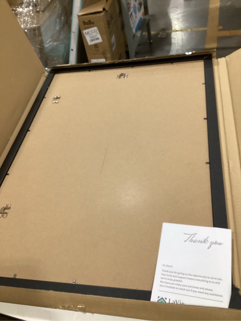 Condition photo showing Good Condition for LaVie Home 20x28 Poster Frame Black, Display Pictures 18x24 with Mat or 20x28 Without Mat, Stable and Sturdy Picture Frame with Polished Plexiglass, Horizontal and Vertical Format of The Wall?1 Pack? 20x28 Black
