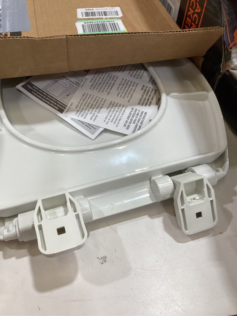 Condition photo showing As Is for mayfair nextstep2 toilet seat with built-in potty training seat, slow-close, removable that will never loosen, elongated, white elongated 1