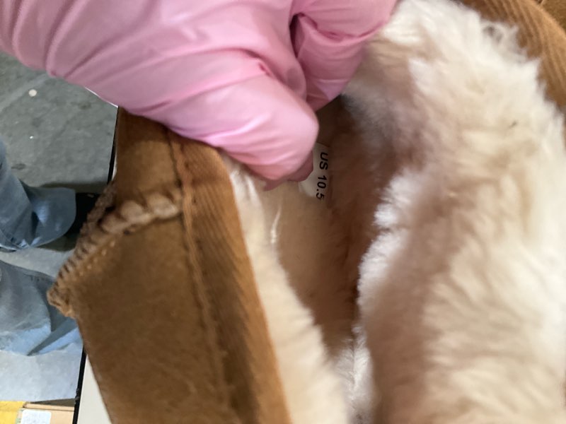 Condition photo showing As Is for 10.5 brown boots