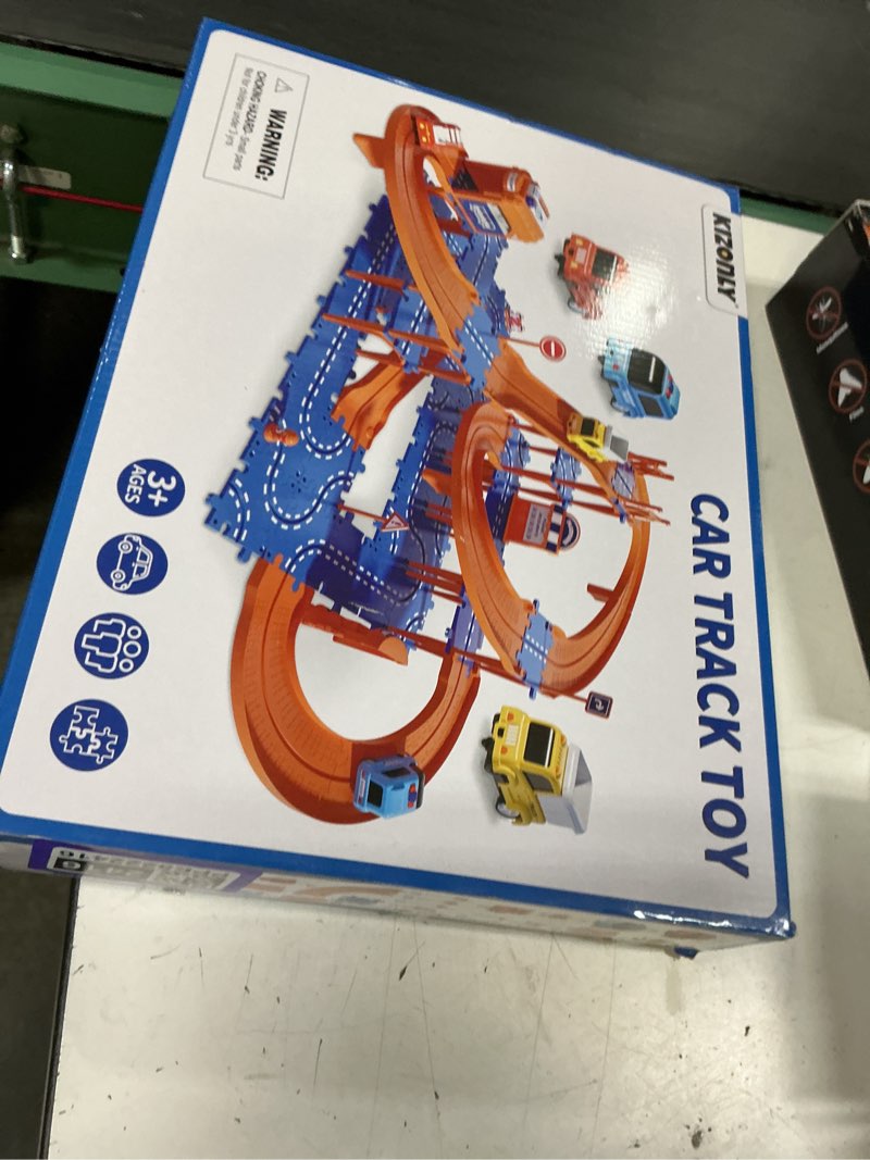 Condition photo showing New/Like New for puzzle racer kids car track set, 4-tier race tracks for kids ages 3-5 with 3 cars, traffic parts, trucks for toddlers 2-4 years, floor puzzle tracks car gift for boys girls 3 4 5 year old 4-layer orange & blue track