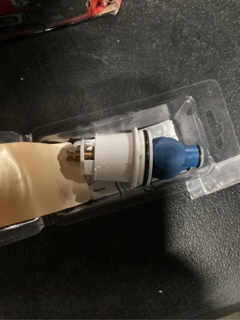 Condition photo showing As Is for danco hot and cold faucet cartridge for delta