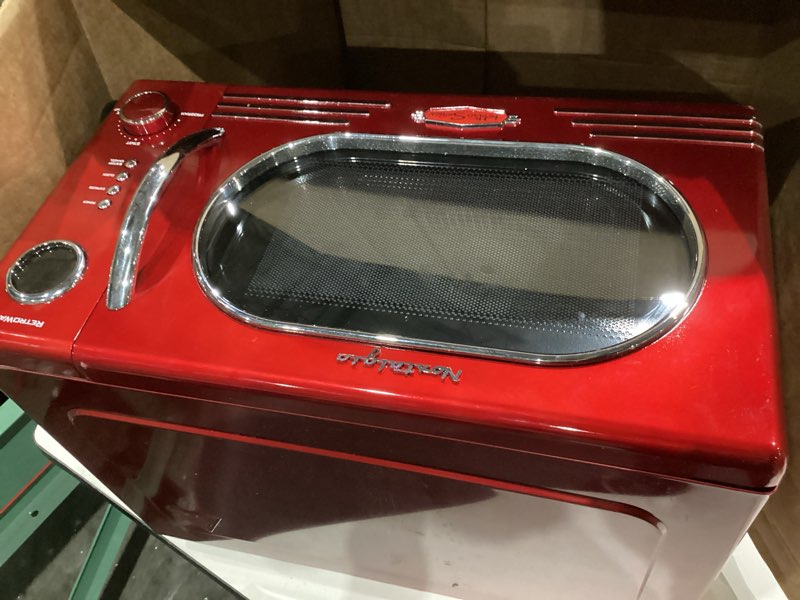 Condition photo showing As Is for nostalgia retro countertop microwave oven - 1.1 cu ft & 1000 watt power- easy to clean with removable glass turntable - child safety lock - 12 programs - digital clock - red retro classic 1.1 cu. ft. red