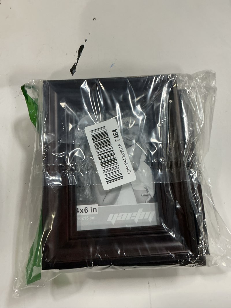 Condition photo showing Good Condition for Yaetm 4x6 Picture Frame Set of 4, 1.4” Wide Molding & Dark Brown Photo Frames with HD Tempered Glass, Display on Tabletop & Wall Mounting, Brown 4x6, 4 pack Dark Brown