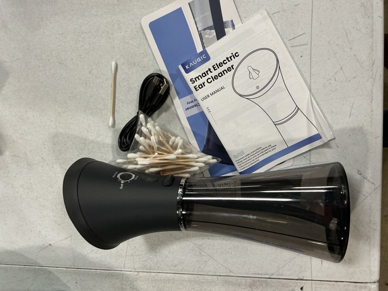 Condition photo showing As Is for kaugic upgraded ear wax removal with one-piece waste tank, safe cleaner with water temperature sensor, effective ear irrigation kit, ipx7, fsa-hsa-eligible, semi-transparent