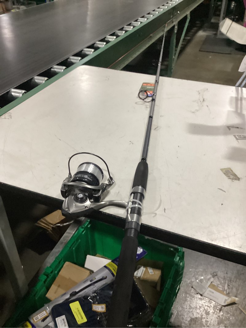 Condition photo showing Good Condition for ozark trail grit stick fishing rod and reel spinning combo, 7-foot medium heavy action 2-piece fishing rod, size 5000 reel, left/right hand retrieve, grey with orange