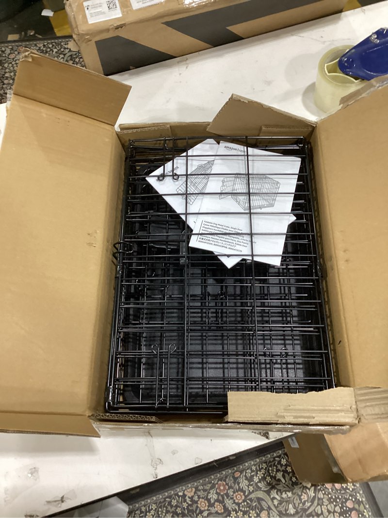 Condition photo showing As Is for Amazon Basics Durable, Foldable Metal Wire Dog Crate with Tray, Single Door, 18 x 12.4 x 15 in, Black 18.0"L x 12.4"W x 15.0"H Single Door no Divider