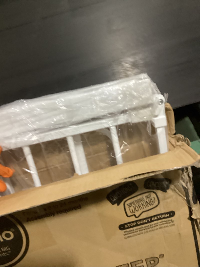 Condition photo showing New/Like New for regalo safety 36" extra tall baby gate for doorways & bottom of stairs, pressure mounted walk through gate for babies, toddlers & pets, tested & safe for 30 years, american designed, american owned white 29-36.5"w x 36"h