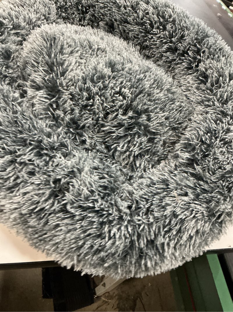 Condition photo showing Good Condition for JOLLYVOGUE Small Dog & Cat Beds for Indoor Cats, Donut Cuddler Warming Soft Dog Beds with Anti-Slip Bottom, Round Calming Fluffy Plush Faux Fur Cushion Bed for Large Dogs (36", Smoke Black) 36.0"L x 36.0"W x 8.0"Th Dark Grey
