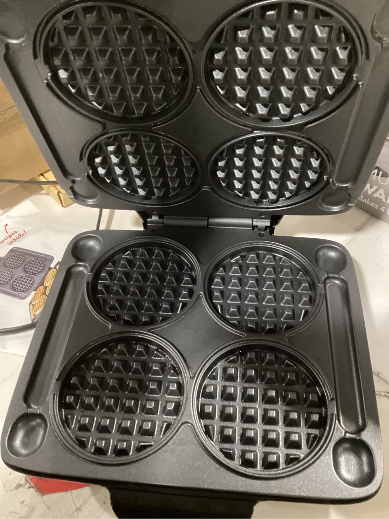 Condition photo showing As Is for dash multi mini waffle maker - makes four waffles at once for family breakfasts - dual nonstick heating plates & easy-release surface - compact & fast-heating - graphite