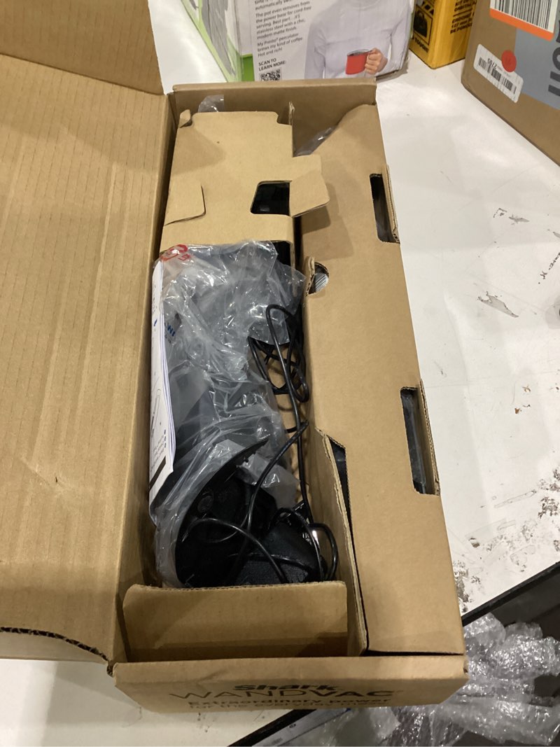 Condition photo showing As Is for Shark WANDVAC Cordless Hand Vac, Lightweight, Versatile and Portable at 1.4 lbs., Powerful Suction, Charging Dock, One-Touch Empty, New Furfins Tool & Crevice Tool for Pet & Home, Gray, WV201WH White