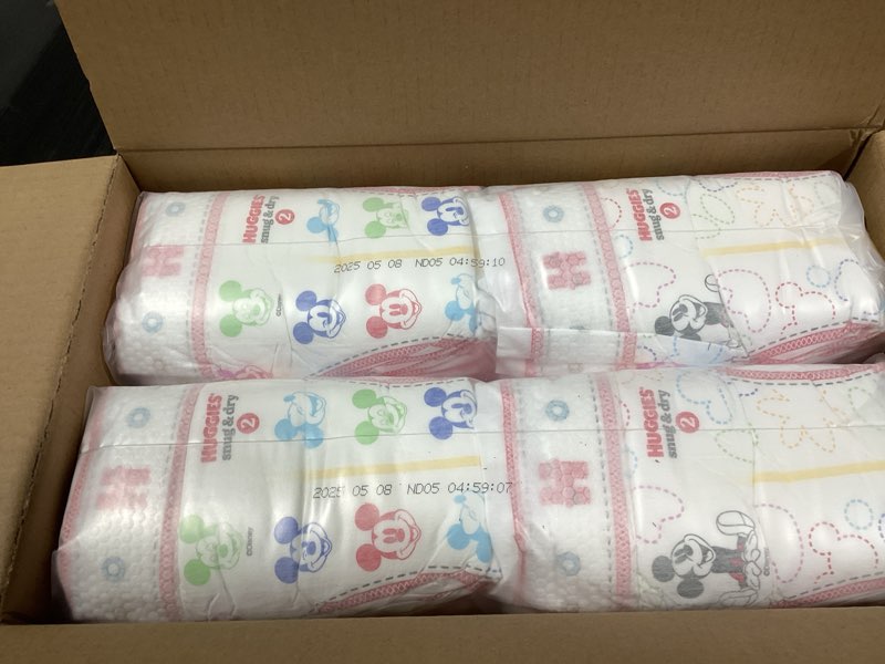 Condition photo showing New/Like New for Huggies Size 2 Diapers, Snug & Dry Baby Diapers, Size 2 (12-18 lbs), 116 Count, Packaging May Vary Size 2 116