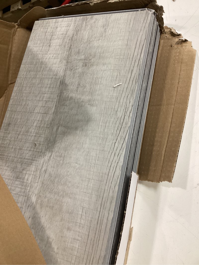 Condition photo showing As Is for procore plus charleston oak 7-in x 47.75-in waterproof interlocking luxury vinyl plank flooring (23.21-sq ft)