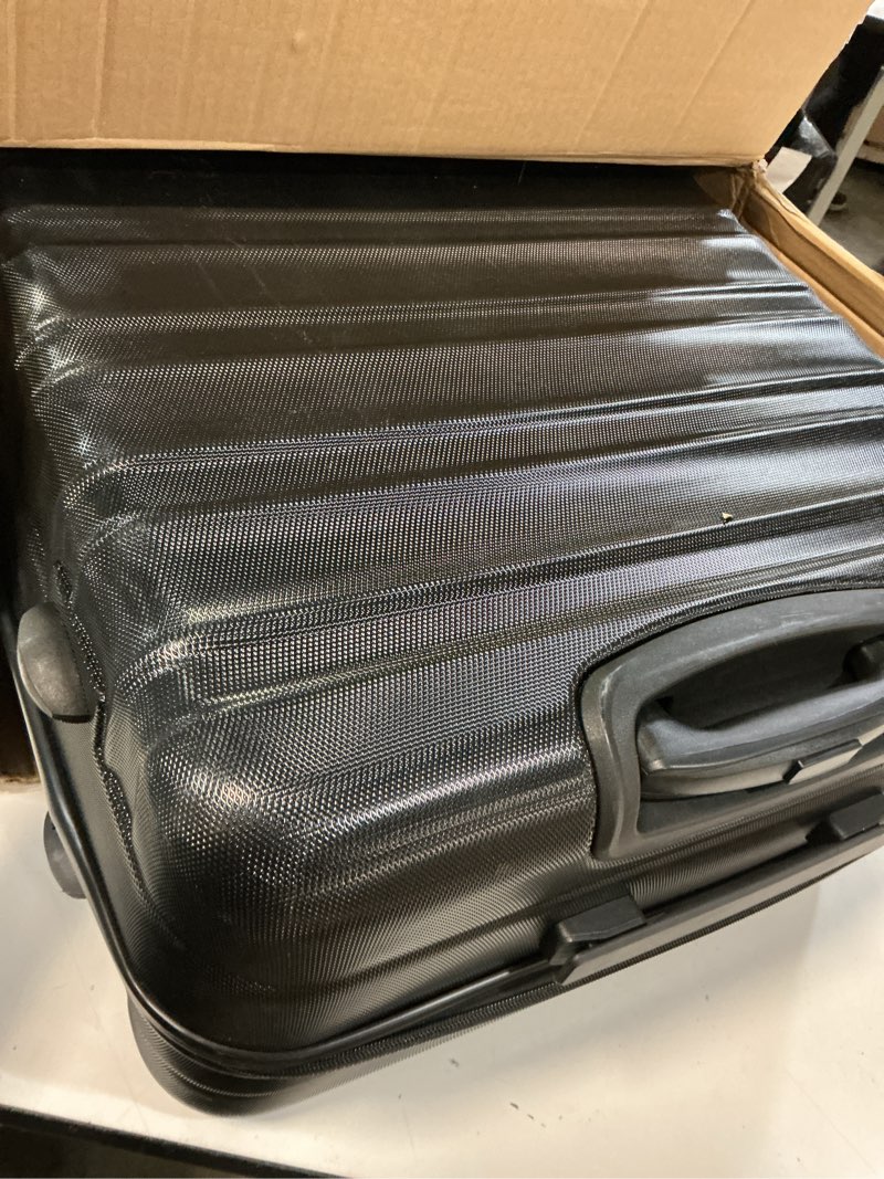 Condition photo showing As Is for Amazon Basics 30" Hardside Large Checked Luggage, Hardshell Suitcase With Wheels, Expandable For Up to 15% More Space, With Scratch-Resistant Surface, Four Multi-directional Wheels, Black Black Large Checked