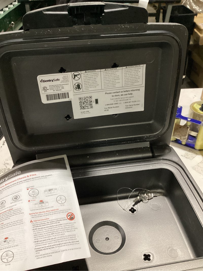 Condition photo showing As Is for sentrysafe dark gray fireproof and waterproof safe with key lock, chest lock box with carrying handle for travel, 0.28 cubic feet, 6.6 x 15.4 x 14.3 inches, cfw20201 1 hr. fireproff, no lid straps