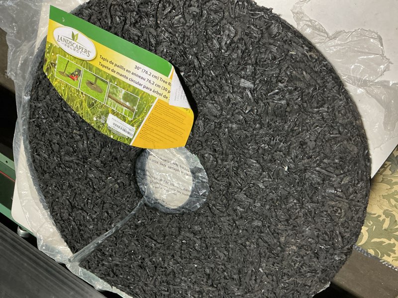 Condition photo showing As Is for rocky mountain tree mulch ring weed preventer - recycled heavy duty rubber - mower safe - no landscape staples needed - textured for natural look - equal water seepage to tree - easy install (30-inch)