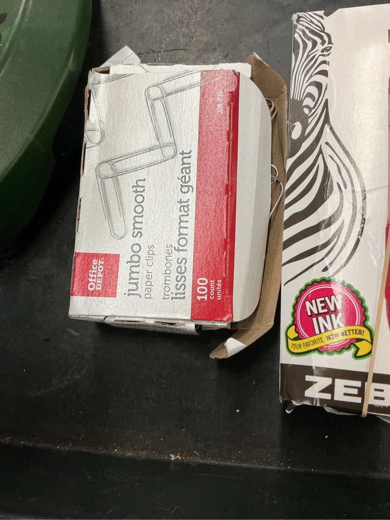 Condition photo showing As Is for set of 2 miscellaneous office items paper clips, pens)