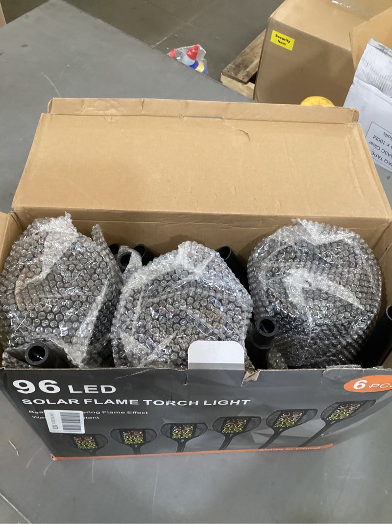 Condition photo showing As Is for otdair 96 led solar lights outdoor upgraded 6 pack, 43" tall & super larger size, waterproof tiki torches for outside, 2200mah solar solar torch light with flickering flame for path yard garden 6 pack warm