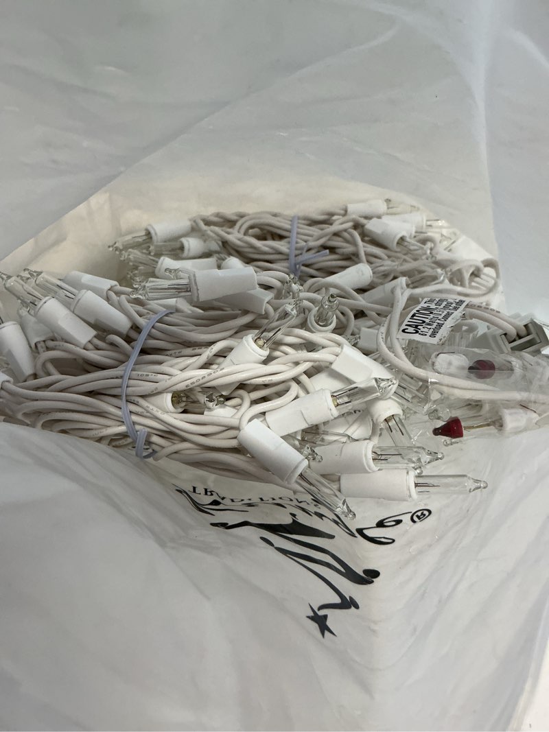 Condition photo showing As Is for Kringle Traditions 8.5 Ft 150 Clear Icicle Christmas Lights – White Wire Indoor/Outdoor String Lights for House and Roof Decorations