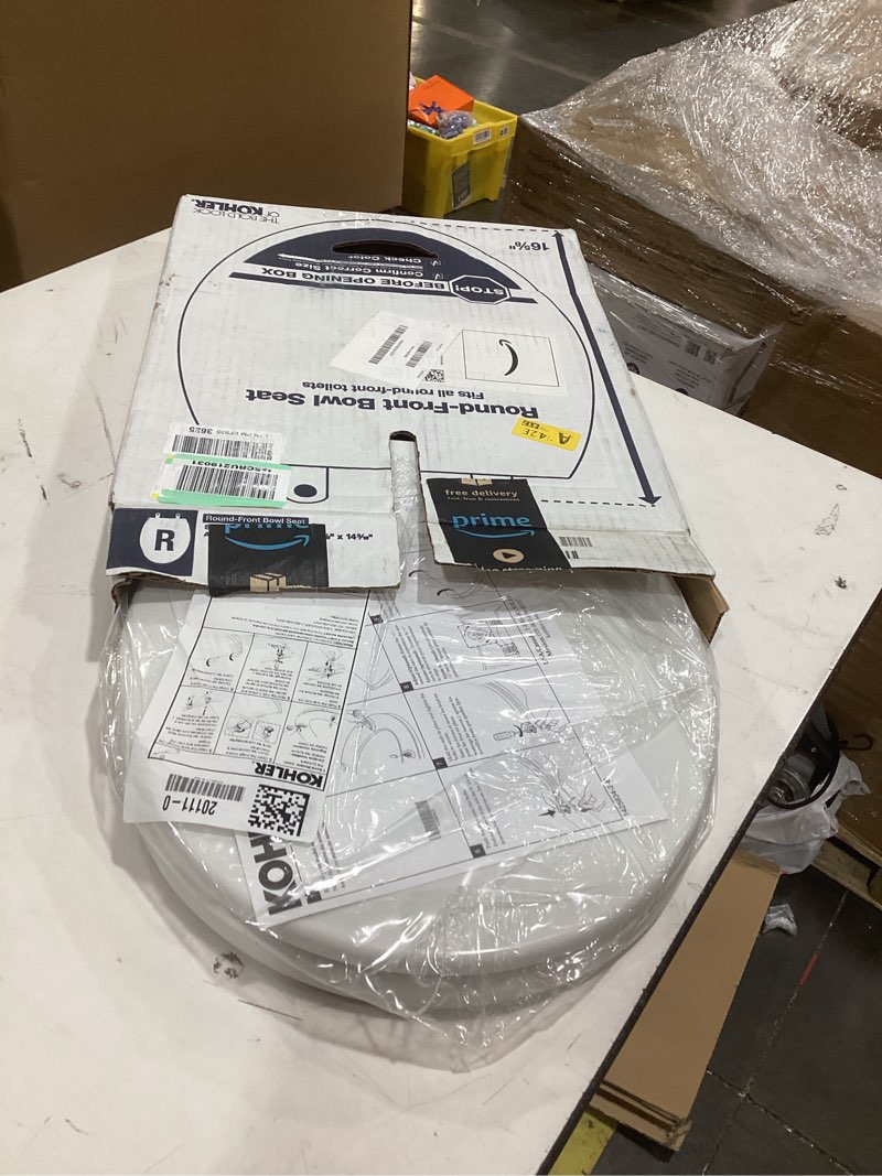 Condition photo showing As Is for kohler 20111-0 brevia, slow close toilet seat, round toilet seat, grip-tight bumpers quick-attach hardware, white