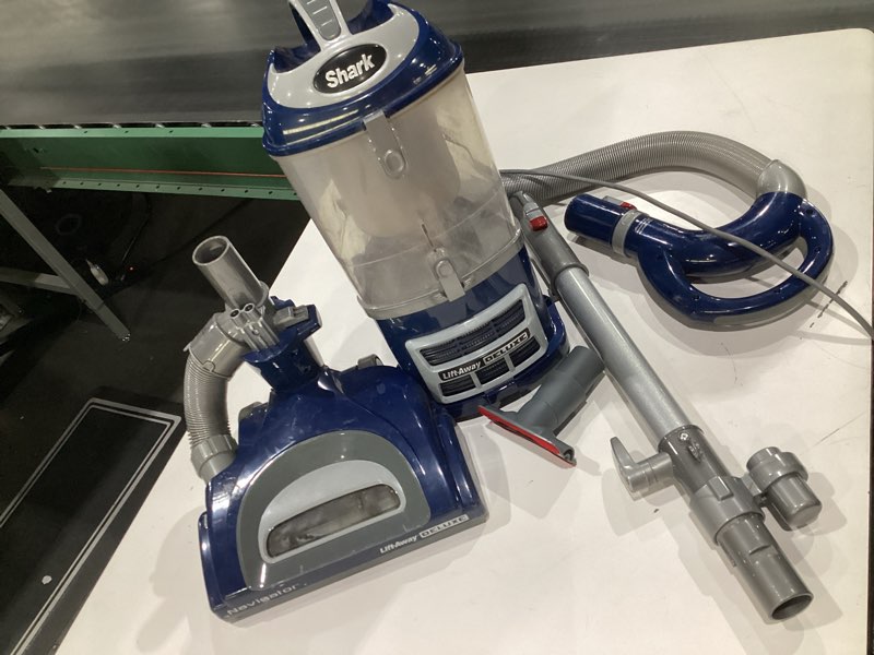 Condition photo showing As Is for (USED, NOT TESTED) Shark Upright Vacuum, Navigator Lift-Away Deluxe with Large Dust Cup Capacity, HEPA Filter, Swivel Steering, Upholstery Tool & Crevice Tool, Blue, NV360