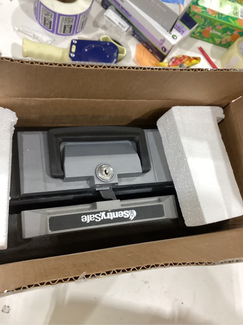 Condition photo showing New/Like New for SentrySafe Fireproof Safe Box with Key Lock, Chest Safe with Carrying Handle to Secure Money, Jewelry, Documents, 0.25 Cubic Feet, 6.3 x 15.3 x 12.1 Inches, 1160 Fire resistant box 0.25 cu. ft.