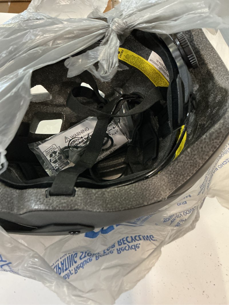 Condition photo showing As Is for ozark trail adult bike helmet with rechargeable rear light-up, black, 9 modes, ages 14+