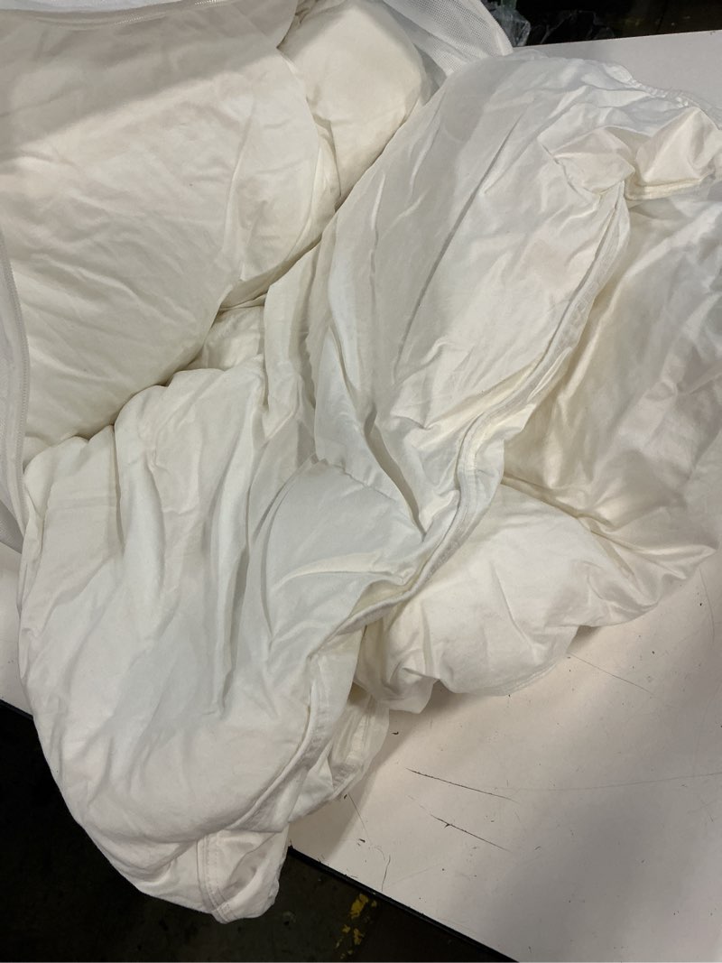 Condition photo showing As Is for quince premium down alternative comforter king/cal king/white 