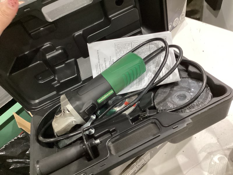 Condition photo showing As Is for metabo hpt 4.5-in 6.2 amps sliding switch corded angle grinder (charger not incldued)