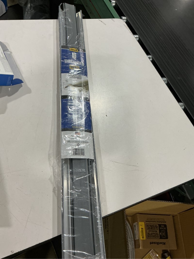 Condition photo showing As Is for m-d building products 1.125 in. h x 3.75 in. w x 36 in. l aluminum deluxe high threshold silver