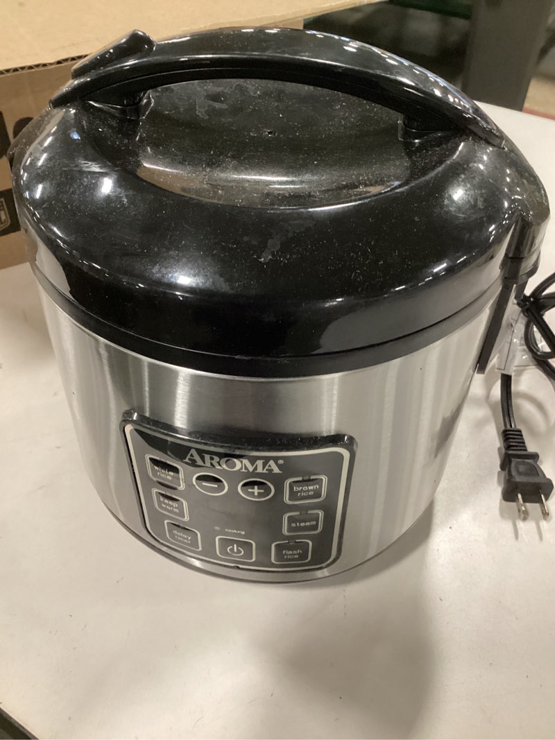 Condition photo showing As Is for (With dent ) ( incomplete missing some accessories) AROMA Digital Rice Cooker, 4-Cup (Uncooked) / 8-Cup (Cooked), Steamer, Grain Cooker, Multicooker, 2 Qt, Stainless Steel Exterior, ARC-914SBD 4 Cup Uncooked / 8 Cup Cooked