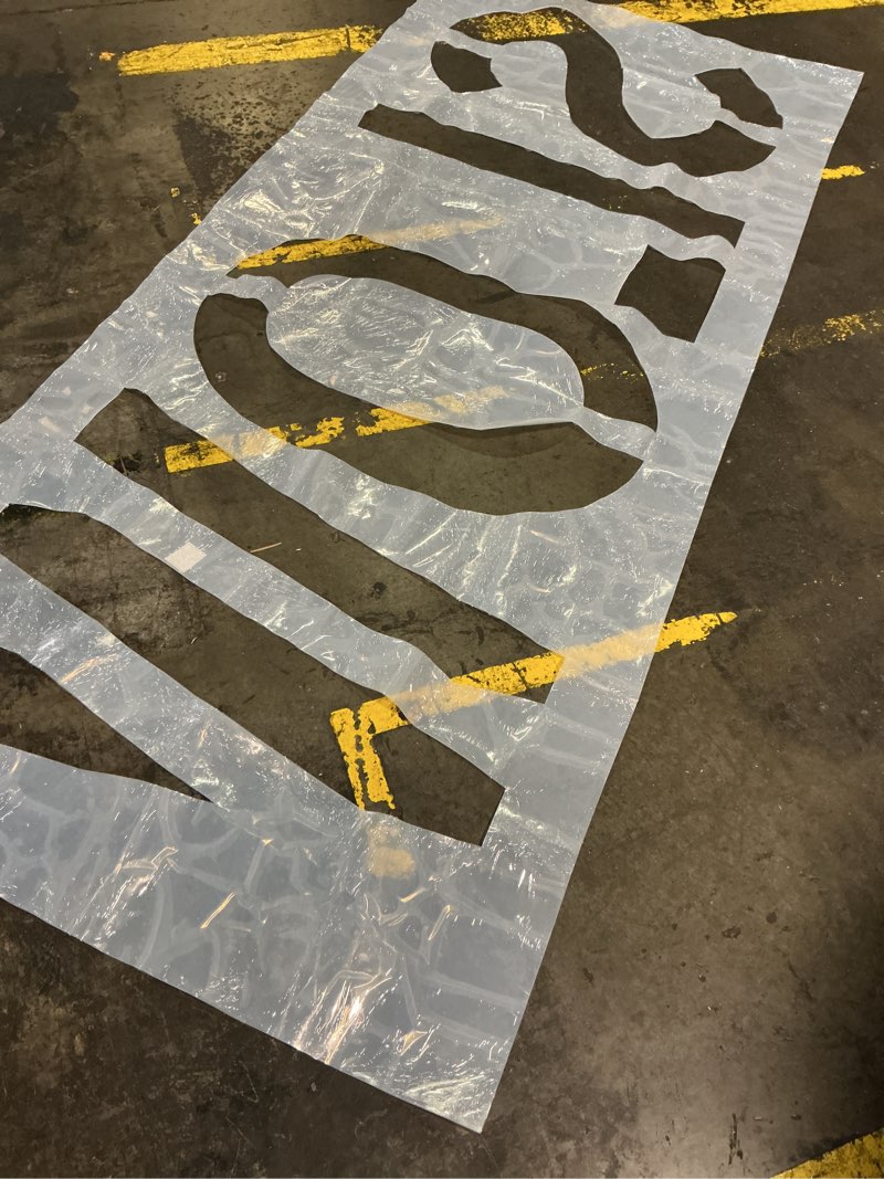 Condition photo showing Good Condition for slow stencil, 36" letter height, reusable foldable silicone slow pavement stencil for asphalt & concrete parking lot markings 45" x 103"