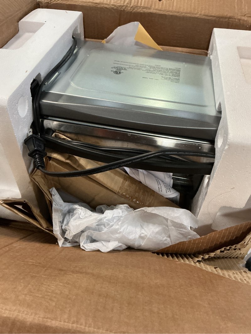 Condition photo showing As Is for Hamilton Beach Easy Reach 4-Slice Countertop Toaster Oven With Roll-Top Door, 1200 Watts, Fits 9” Pizza, 3 Cooking Functions for Bake, Broil and Toast, Silver (31344DA) Silver 4-Slice