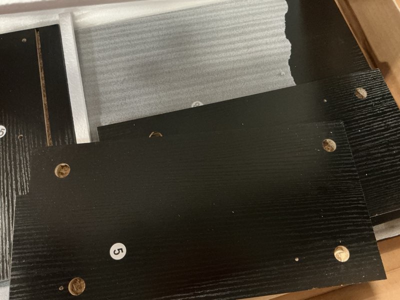 Condition photo showing As Is for (incomplete) corner tv stand for tvs black/bronw 