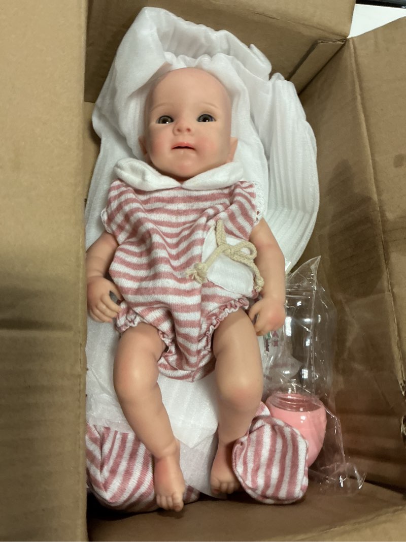 Condition photo showing New/Like New for 13 inch full silicone reborn baby doll, realistic real eye open baby girl doll, newborn toddler for ages