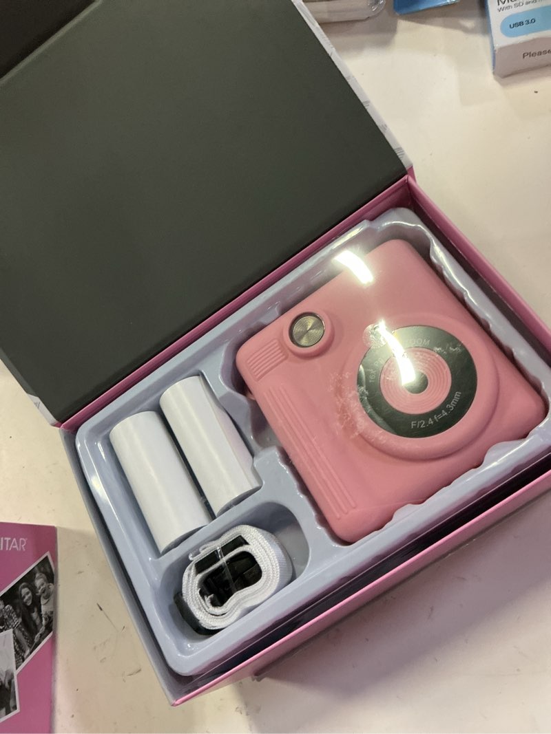 Condition photo showing Good Condition for vivitar instaprint digital camera, 12mp, 4 games, 2 rolls of paper, instantly prints 2" x 3" pictures -pink