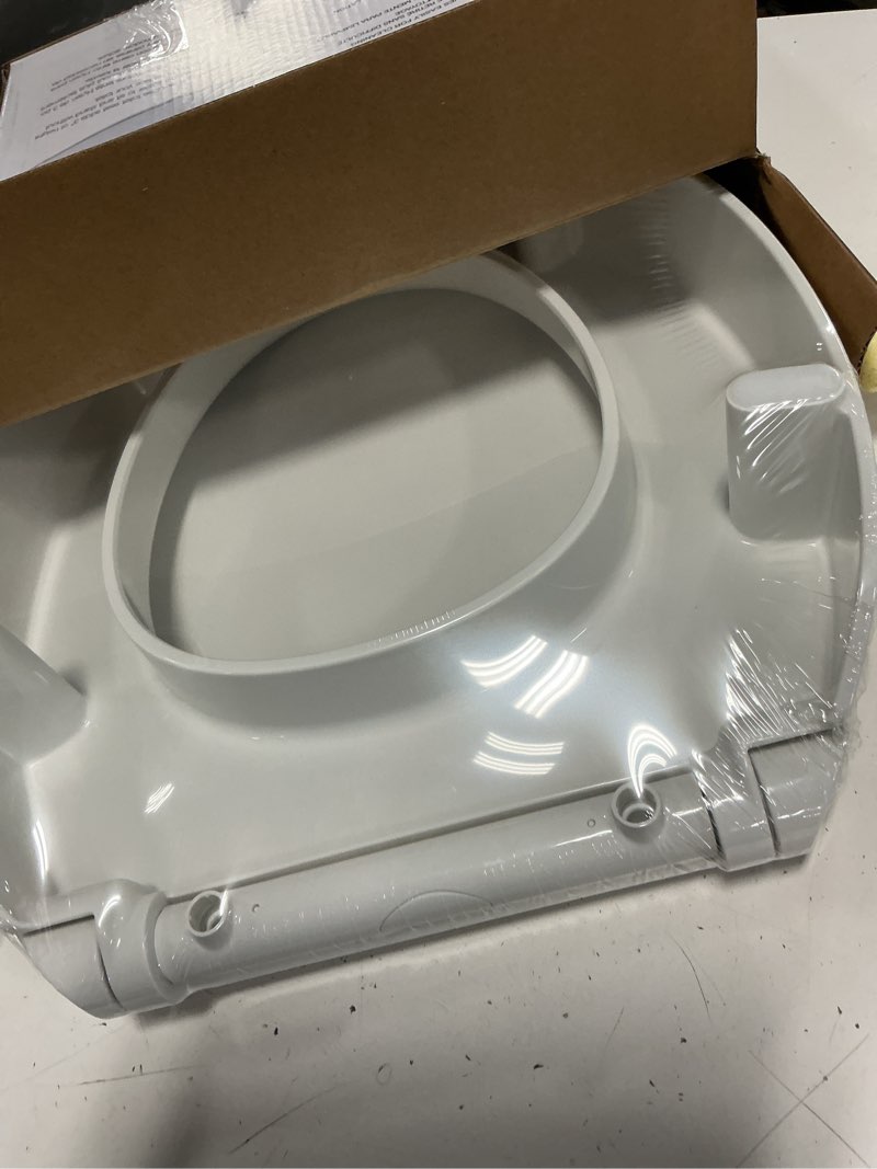 Condition photo showing New/Like New for kohler hyten slow close round white plastic toilet seat