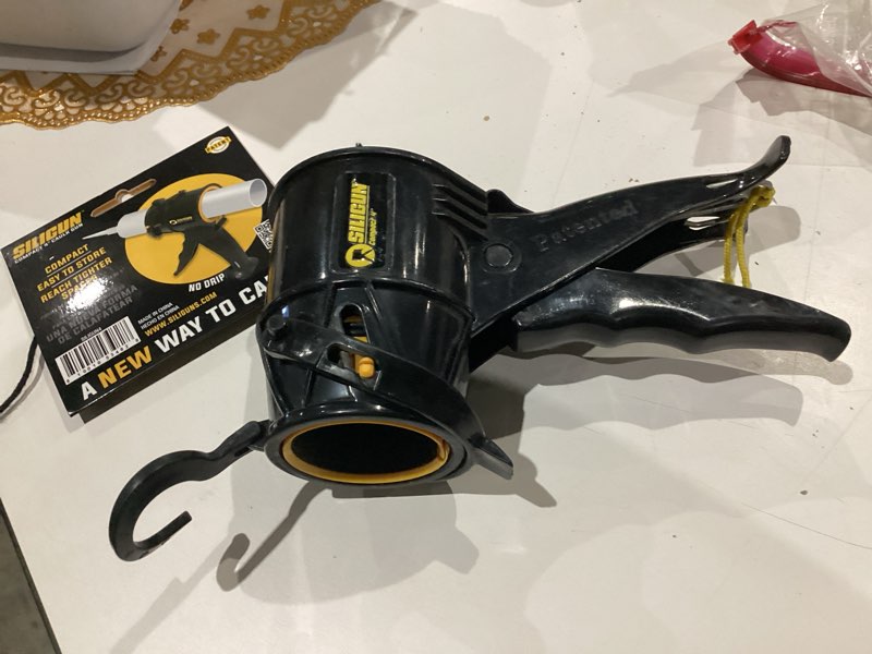 Condition photo showing As Is for siligun professional plastic drip free caulking gun