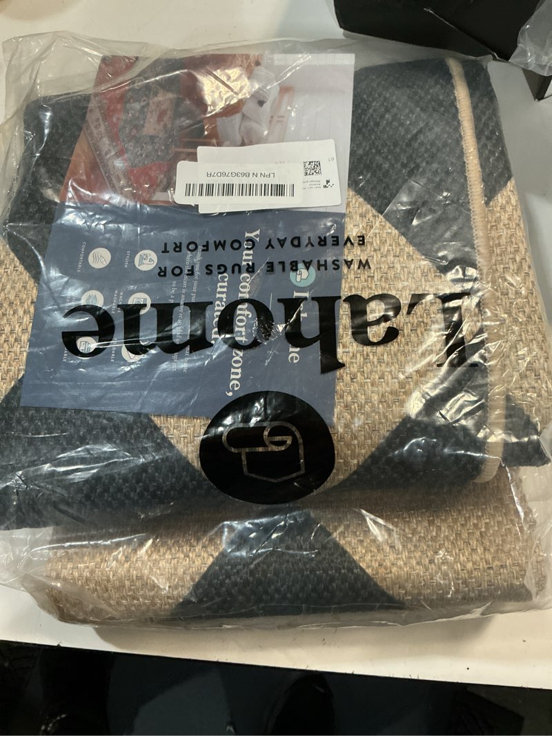 Condition photo showing New/Like New for lahome colette checkered easy jute runner rug, 2x8 hallway kitchen runner rug non slip washable outdoor carpet for entryway indoor, checkerboard black indoor outdoor carpet for hallway 8ft entry 2'6" x 8' (runner) black/checkerboard -2