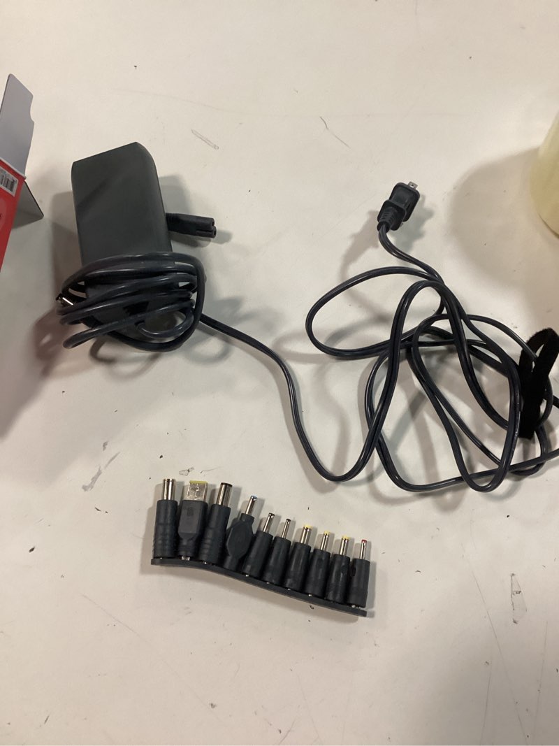 Condition photo showing As Is for onn 90w laptop charger with 10 interchangeable tips, 10 ft power cord for hp, dell, lenovo, laptop