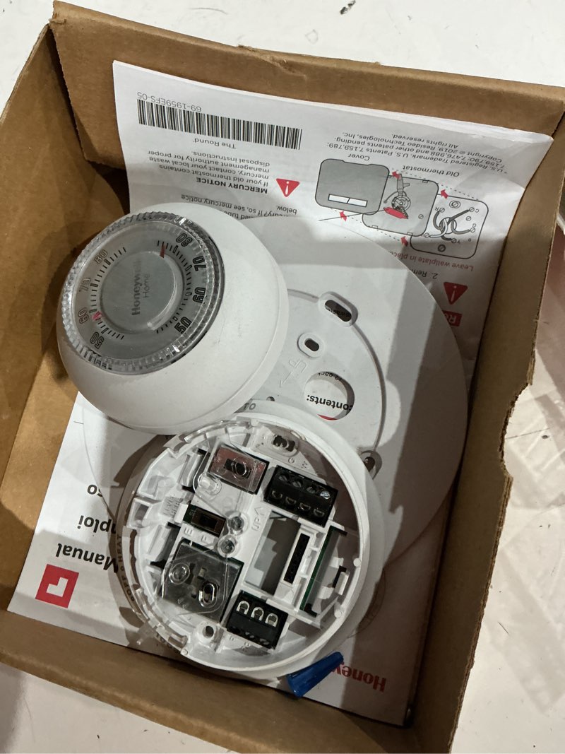 Condition photo showing As Is for honeywell home round non-programmable thermostat with 1h/1c single stage heating and cooling