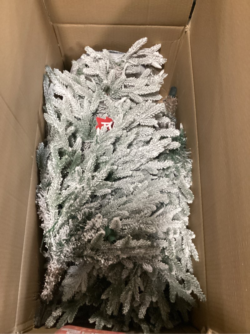 Condition photo showing As Is for Puleo International 6ft Pre-Lit Potted Flocked Arctic Fir Pencil Christmas Tree with 120 Warm White Lights, 1325 Realistic Dense Snow Flocked Branch Tips, Easy Setup Artificial Trees with Sturdy Stand 6' Flocked Arctic Fir 120 Clear Lights